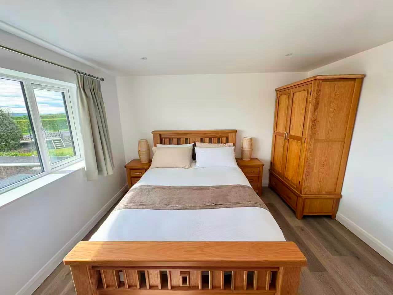Bedroom two with a double bed and wardrobe