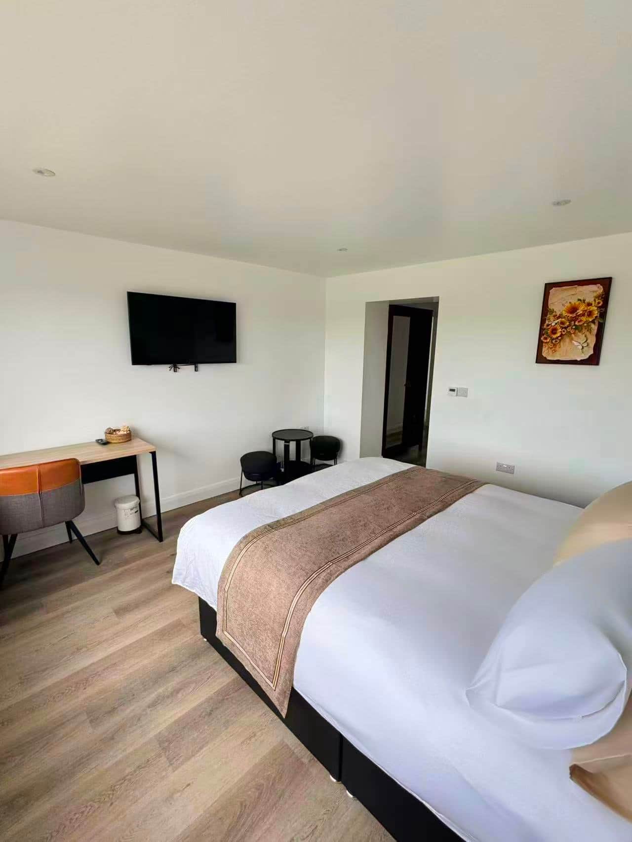 Bedroom one with television and work desk