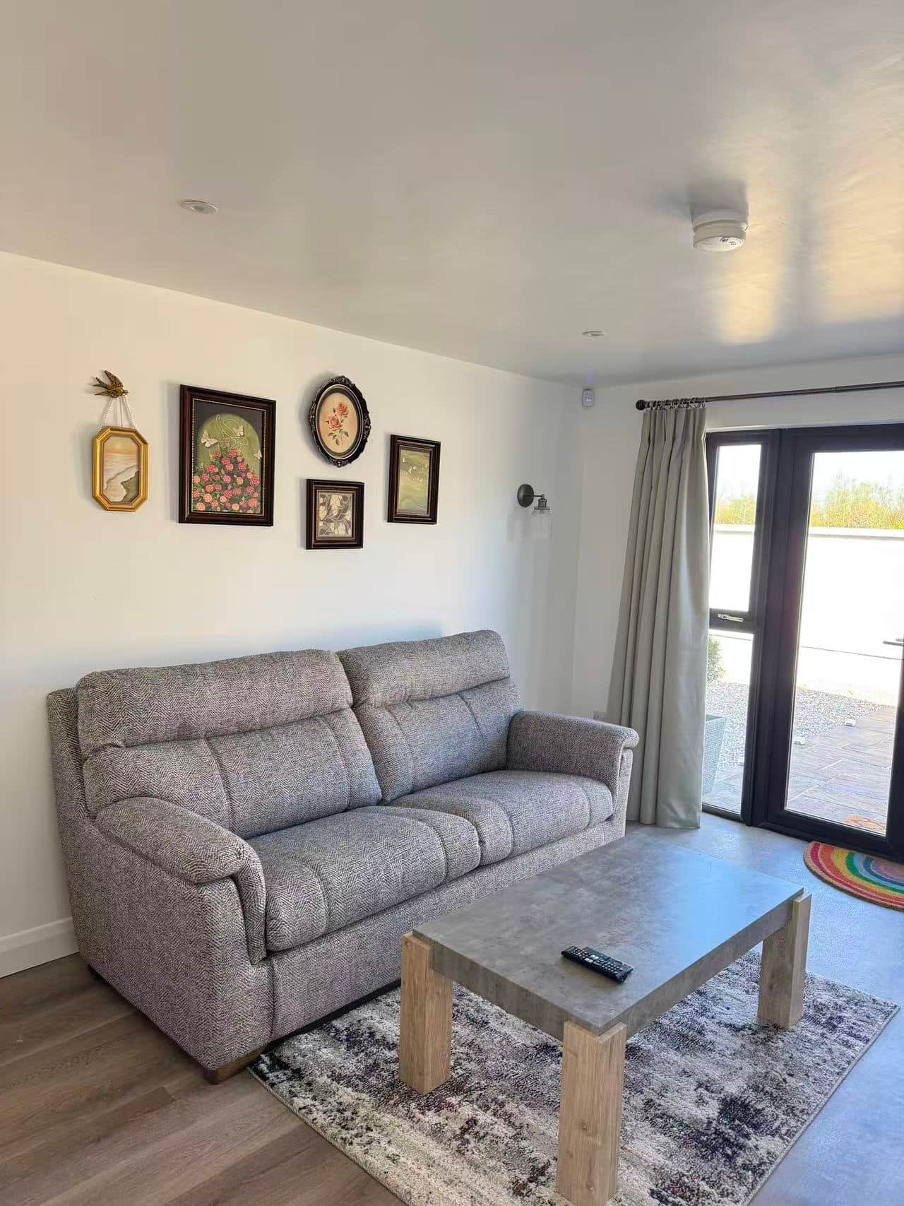 Sitting room sofa beside the patio doors