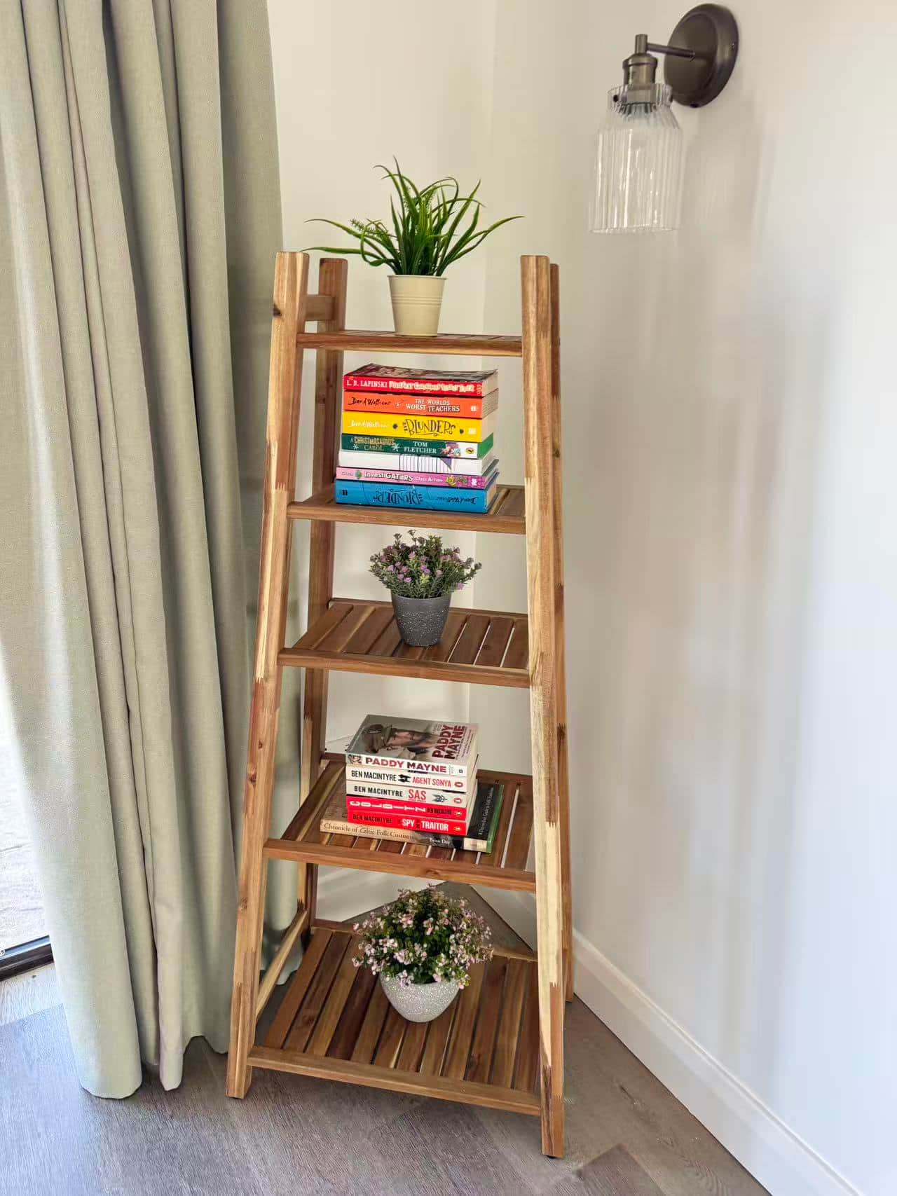 Reading shelf with books and plants