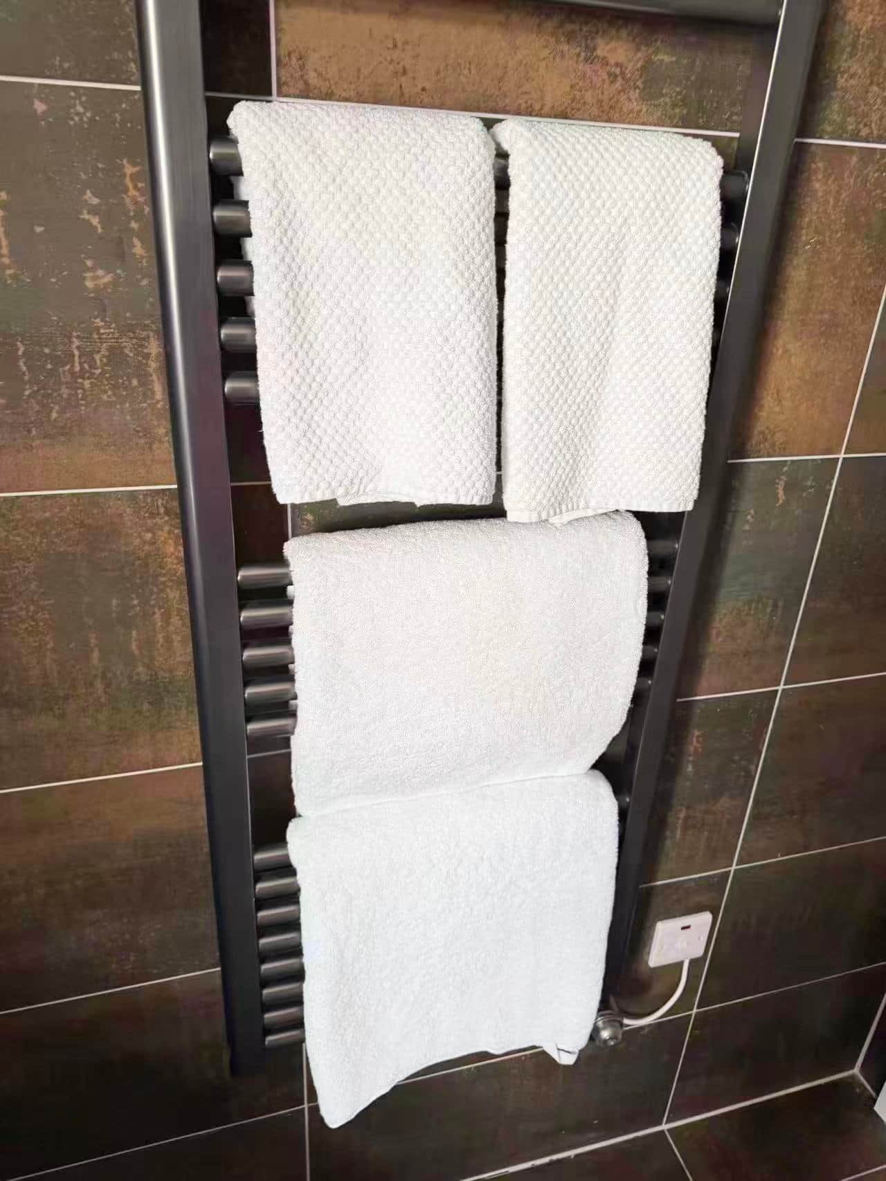 Fresh towels on the heated bathroom rail